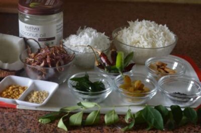 Fragrant Coconut Rice with Toasted Cashews and Curry Leaves - Plattershare - Recipes, food stories and food lovers Coconut rice garnished with toasted cashews and fresh curry leaves, ready to serve.