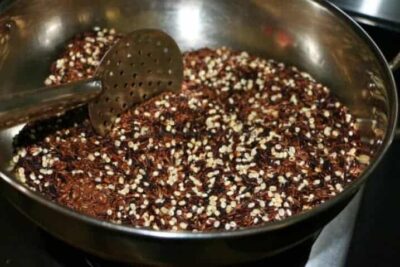 Nourishing Black Rice, Barley, and Flax Seed Congee - Plattershare - Recipes, food stories and food lovers Black rice, barley, and flax seed congee in a cooking pot, ready to serve as a nutritious breakfast.