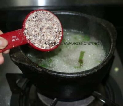 Nourishing Black Rice, Barley, and Flax Seed Congee - Plattershare - Recipes, food stories and food lovers Nourishing Black Rice, Barley, and Flax Seed Congee in a pot, ready to cook for a healthy meal.
