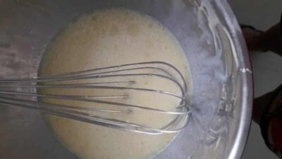 Healthy Chia Seed Cupcakes: A Guilt-Free Indulgence - Plattershare - Recipes, food stories and food lovers Mixing batter for healthy chia seed cupcakes in a bowl with a whisk.