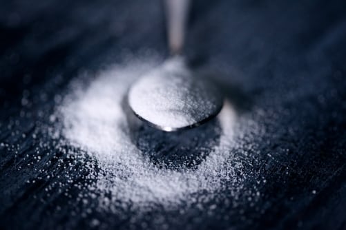 6 Keto Approved Sweeteners To Use Instead Of Sugar - Plattershare - Recipes, food stories and food lovers Metal spoon with flour on dark surface, culinary ingredients, baking, cooking, food preparation, kitchen tools.