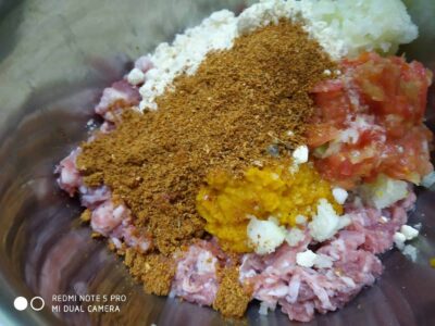 Kaleji Keema Balls: A Flavorful Mutton Recipe - Plattershare - Recipes, food stories and food lovers Mixed raw meat with spices and ingredients for sausage preparation.