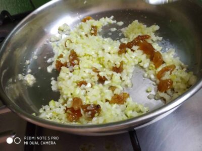 Healthy Papaya Laddoo: A Delicious and Nutritious Indian Treat - Plattershare - Recipes, food stories and food lovers Golden fried onions with caramelized sugar in a stainless steel pan, ready for cooking or garnishing.
