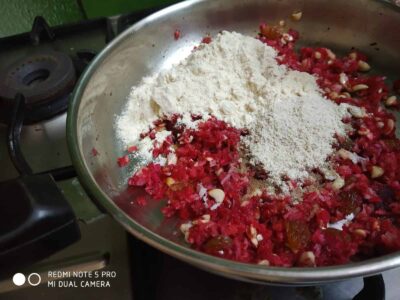 Healthy Papaya Laddoo: A Delicious and Nutritious Indian Treat - Plattershare - Recipes, food stories and food lovers Finely chopped tomatoes, garlic, and spices in a steel pan with flour ready for cooking.
