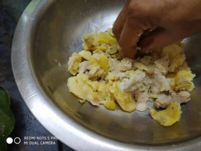 Nutrient-Rich Rajgira Tikki (Amaranth Fritters) for Fasting and Everyday Meals - Plattershare - Recipes, food stories and food lovers Creamy mashed potatoes being prepared with a hand mixing in a stainless steel bowl.