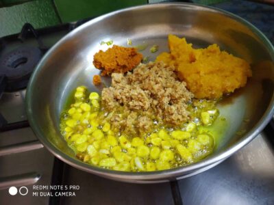 Hearty Red Lentil and Mutton Liver Stew (Lal Masoor Kaleji) - Plattershare - Recipes, food stories and food lovers Steamed corn with chutney, cooked polenta, and spices in a frying pan for a delicious recipe.