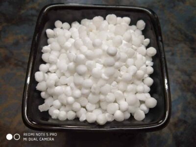 Healthy Sago Tikki (Sabudana Tikki): A Quick & Nutritious Snack or Light Meal - Plattershare - Recipes, food stories and food lovers Small white spherical snacks in a black bowl, ready for cooking or serving.