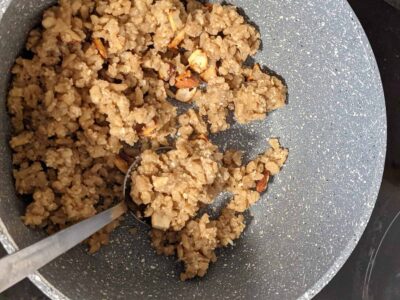 Quick & Easy Puffed Rice Pongal: A Healthy Indian Dessert - Plattershare - Recipes, food stories and food lovers Savory cooked minced meat in a non-stick pan, ready for recipe preparation.