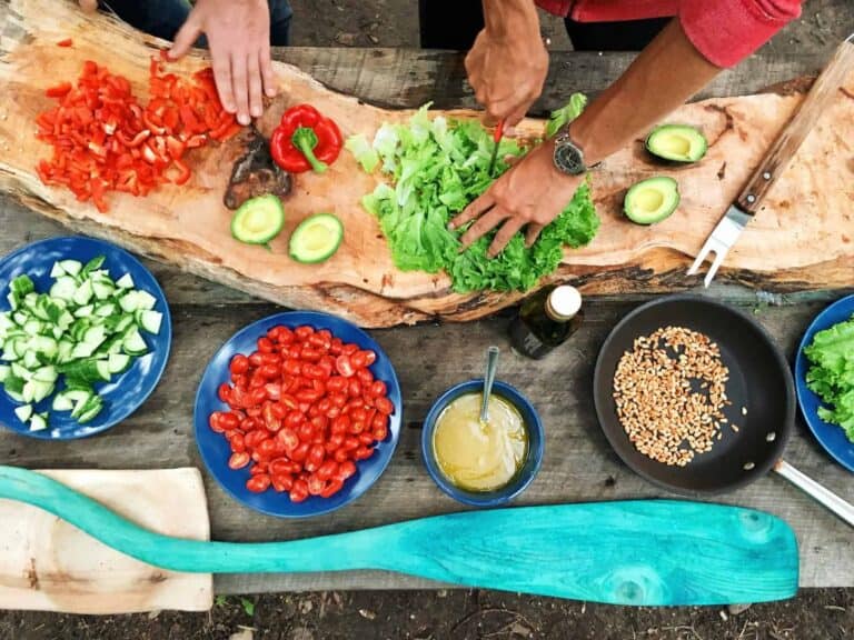 Becoming a Better Cook at Home: 6 Things You Should Do - Plattershare - Recipes, food stories and food lovers Fresh vegetables being prepared for a delicious meal on a rustic wooden surface.