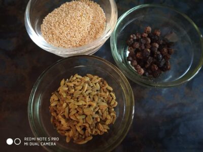 Creamy Vegan Thandai: A Refreshing & Healthy Indian Drink - Plattershare - Recipes, food stories and food lovers Dried spices on glass bowls, including black peppercorns, cumin seeds, and mustard seeds.