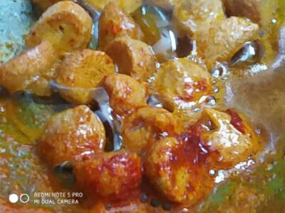 Lauki Moong Badi: A Simple and Flavorful Indian Bottle Gourd Curry - Plattershare - Recipes, food stories and food lovers Savory fried veggie balls in spicy tomato sauce, perfect for snacking or appetizers.
