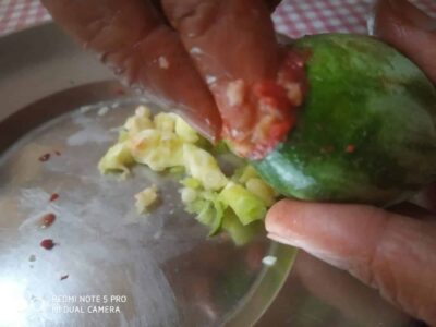 Spiced Stuffed Pointed Gourd: A Flavorful Bengali Vegetarian Recipe - Plattershare - Recipes, food stories and food lovers Fresh green chili being deseeded for cooking or preserving.