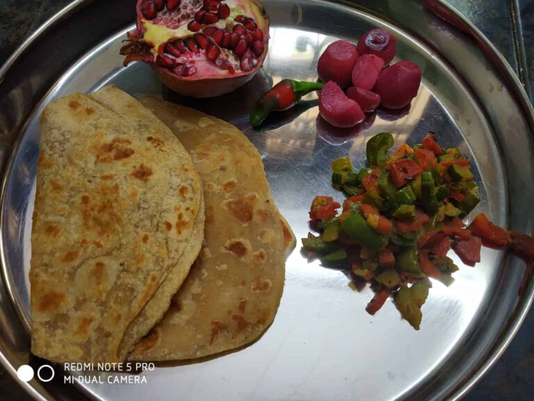 Flavorful Zucchini and Mixed Vegetable Stir-Fry - Plattershare - Recipes, food stories and food lovers Sliced stuffed paratha with assorted colorful vegetables and fruits on stainless steel plate.
