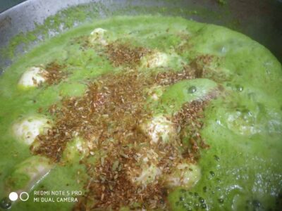 Creamy Green Pea Curry (Mattar Ka Nimona) - Plattershare - Recipes, food stories and food lovers Savory green herb sauce with spices and herbs, cooking in a pan for a delicious dish.