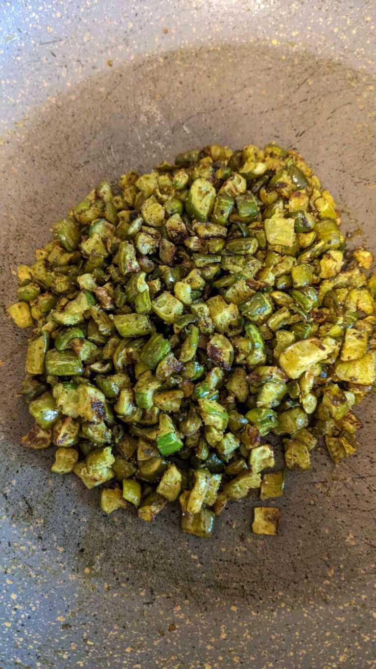 Crispy Ivy Gourd Fry (Dondakaya Fry): Healthy Indian Side Dish - Plattershare - Recipes, food stories and food lovers Sautéed green beans with spices on a rustic brown surface.