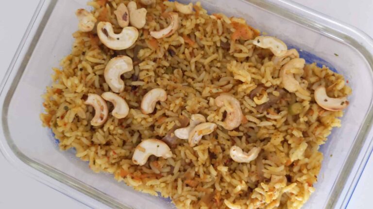 Healthy Oats Biryani: A Quick & Delicious Vegetarian Recipe - Plattershare - Recipes, food stories and food lovers Creamy vegetable fried rice with cashews in a glass dish, quick and flavorful Asian-inspired meal.