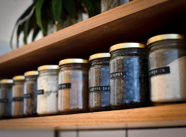 Spice jars on a wooden rack - Innovative Storage Solutions for Your Spices Collection