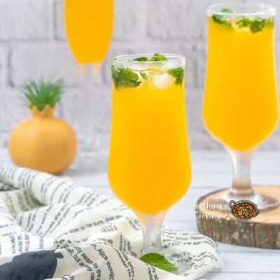 Raise a Glass Without the Buzz: Best Mocktails and Non-Alcoholic Drinks for Any Occasion - Plattershare - Recipes, food stories and food lovers Refreshing mango mojito with mint garnished in tall glasses for summer drinks.