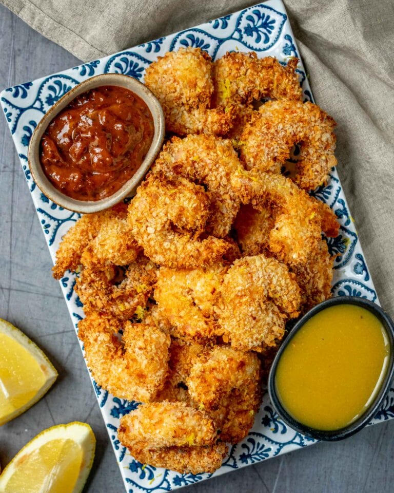 Crispy Golden Prawns (ITC Style) - Plattershare - Recipes, food stories and food lovers Crispy fried chicken nuggets with dipping sauces and lemon wedges. Perfect for snacks or appetizers.