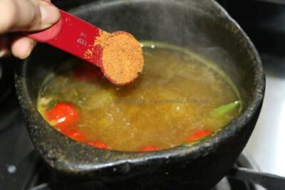 Wheatgrass Rasam in a traditional South Indian style with tangy flavors and fresh ingredients.