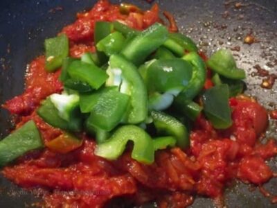 Delicious Indian paneer cooked on tawa with spices and fresh vegetables. Perfect for a restaurant-st.