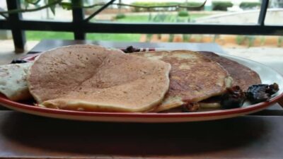 Delicious healthy chia seed pancakes topped with banana and dates for a nutritious breakfast.