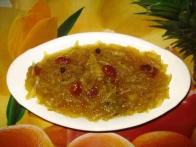 Raw papaya chutney with spices and sugar, a traditional Indian condiment.