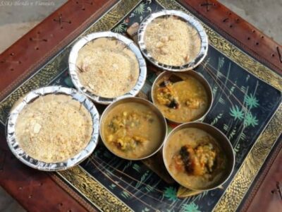 Traditional Rajasthani smoky barbequed baati served with creamy dal and sweet churma.