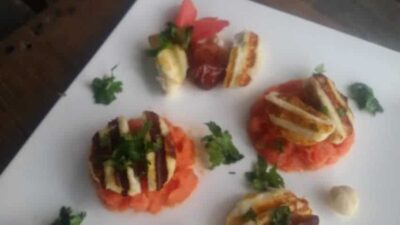 Delicious grilled paneer stuffed with dates and hazelnuts served with carrot sauce.