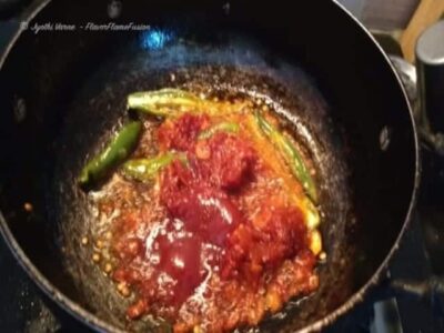 Chili garlic paneer cooking in a wok, showcasing a fiery Indo-Chinese dish with vibrant flavors and.