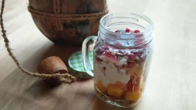 Delicious mango and apple chia seed parfait in a glass jar, perfect for a healthy breakfast or snack.