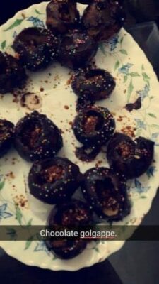 Chocolate golgappe with sprinkles and rich flavor.