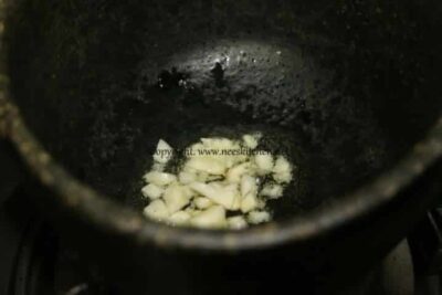 Pot with cooking grains for nourishing congee dish.