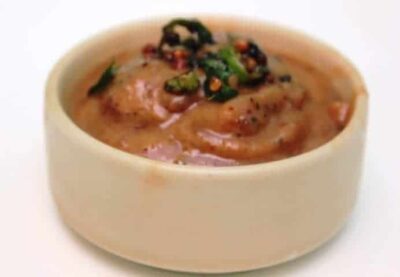 Sweet, spicy, and tangy Date & Raisin Chutney served in a small bowl. Perfect for pairing with snack.