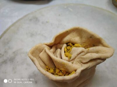 Delicious Indian samosa with spiced filling, served on a white plate. Perfect for snacks and tea-time treats.