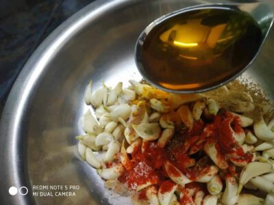 Fresh garlic, spices, and oil ready for flavorful cooking.