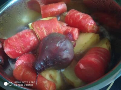 Freshly prepared mixed vegetables in a cooking pot, ready for a hearty meal or stew.