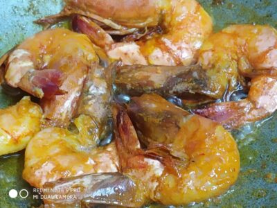 Juicy shrimp cooked in flavorful spices with a rich, spicy sauce, perfect for seafood lovers and tasty appetizer options.